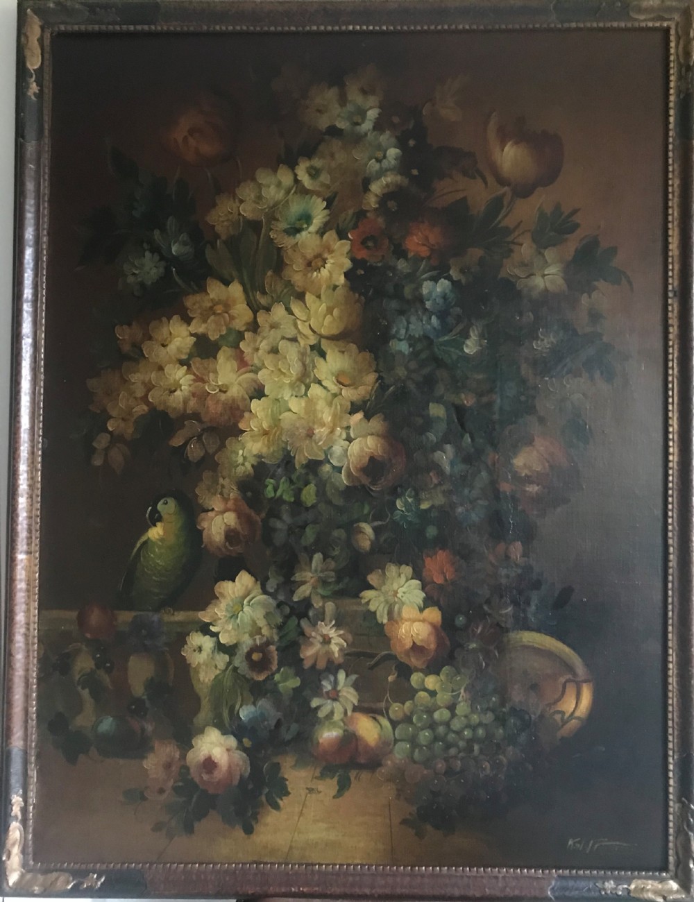 still life of fruit flowers and a parrot c18801910